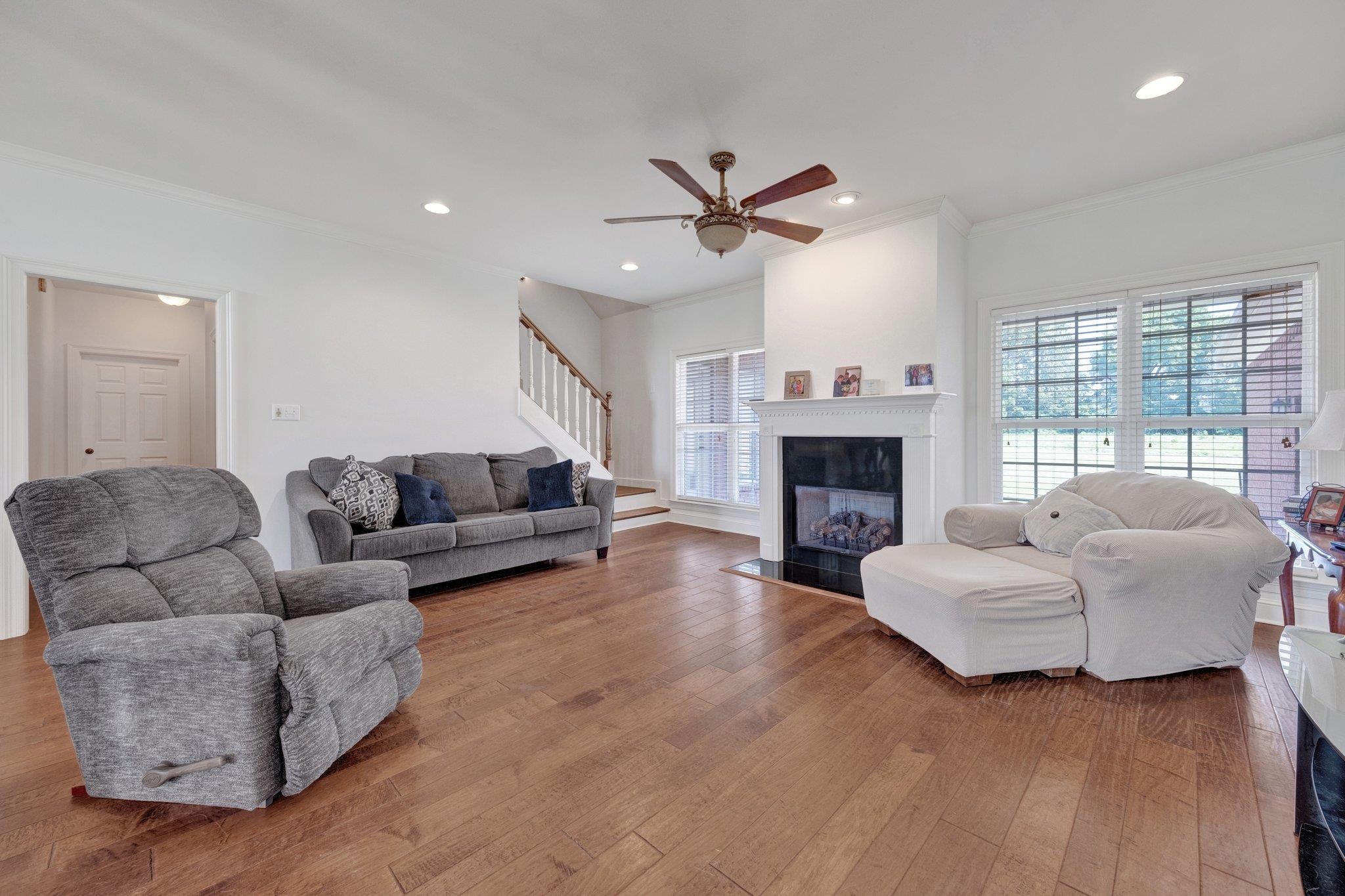 914 Beaver Creek Road Brighton, TN 38011 - Photo 14 of 38 a living room with furniture a fireplace and a large window
