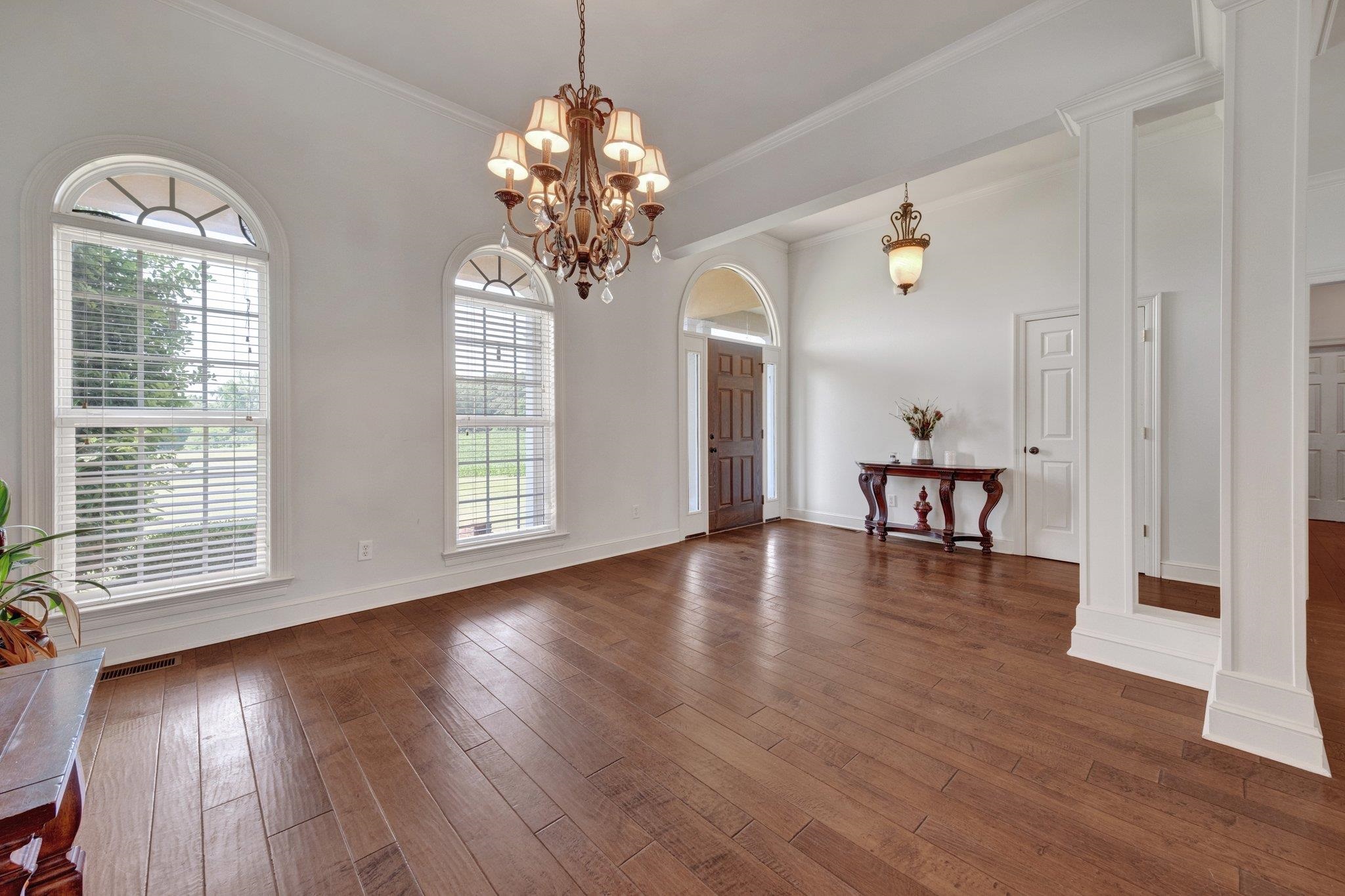 914 Beaver Creek Road Brighton, TN 38011 - Photo 15 of 38 a view of a room with wooden floor chandelier and windows