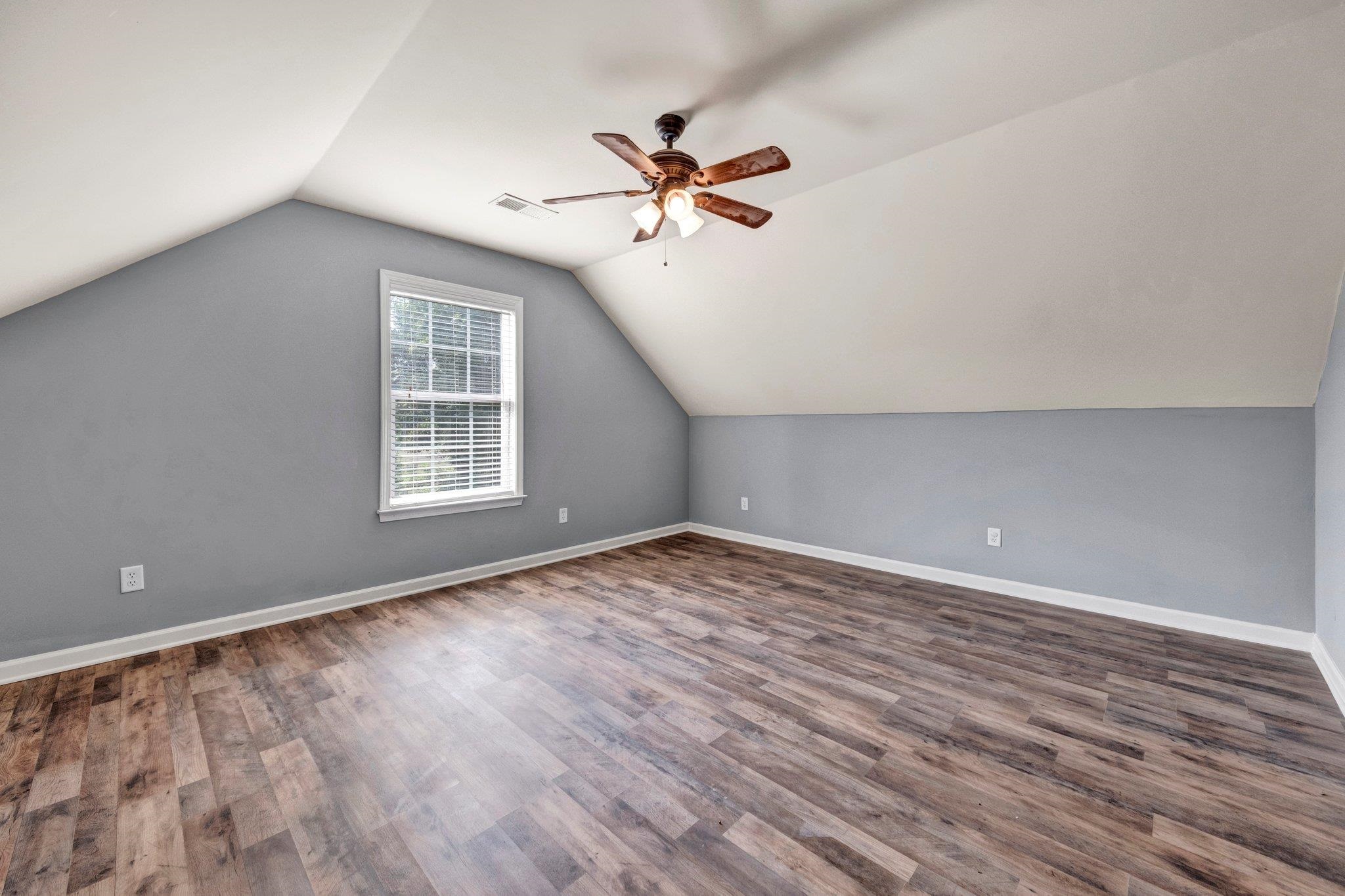 914 Beaver Creek Road Brighton, TN 38011 - Photo 23 of 38 wooden floor in an empty room with a window