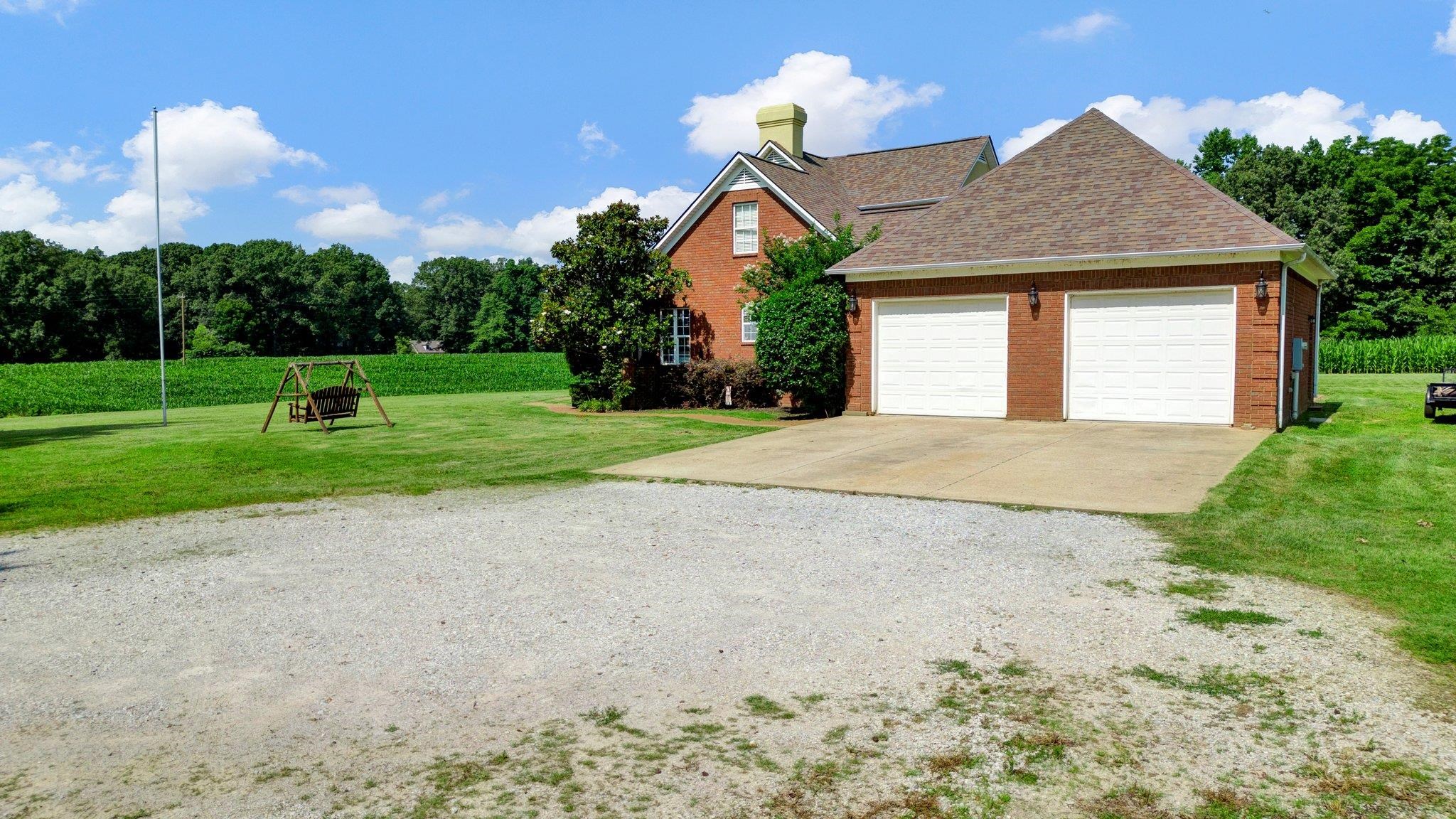 914 Beaver Creek Road Brighton, TN 38011 - Photo 33 of 38 a front view of a house with a yard and garage
