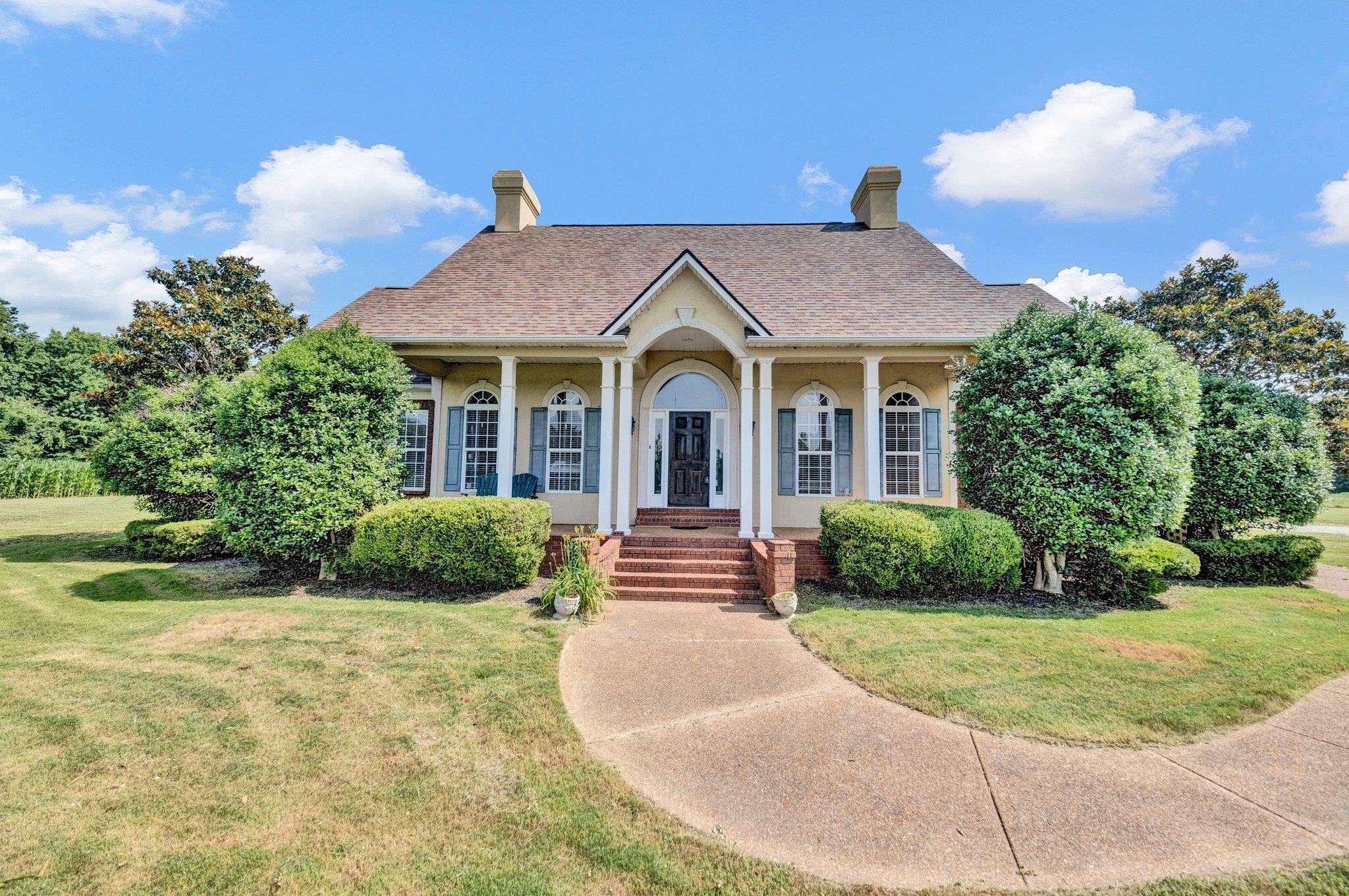914 Beaver Creek Road Brighton, TN 38011 - Photo 4 of 38 a front view of a house with garden