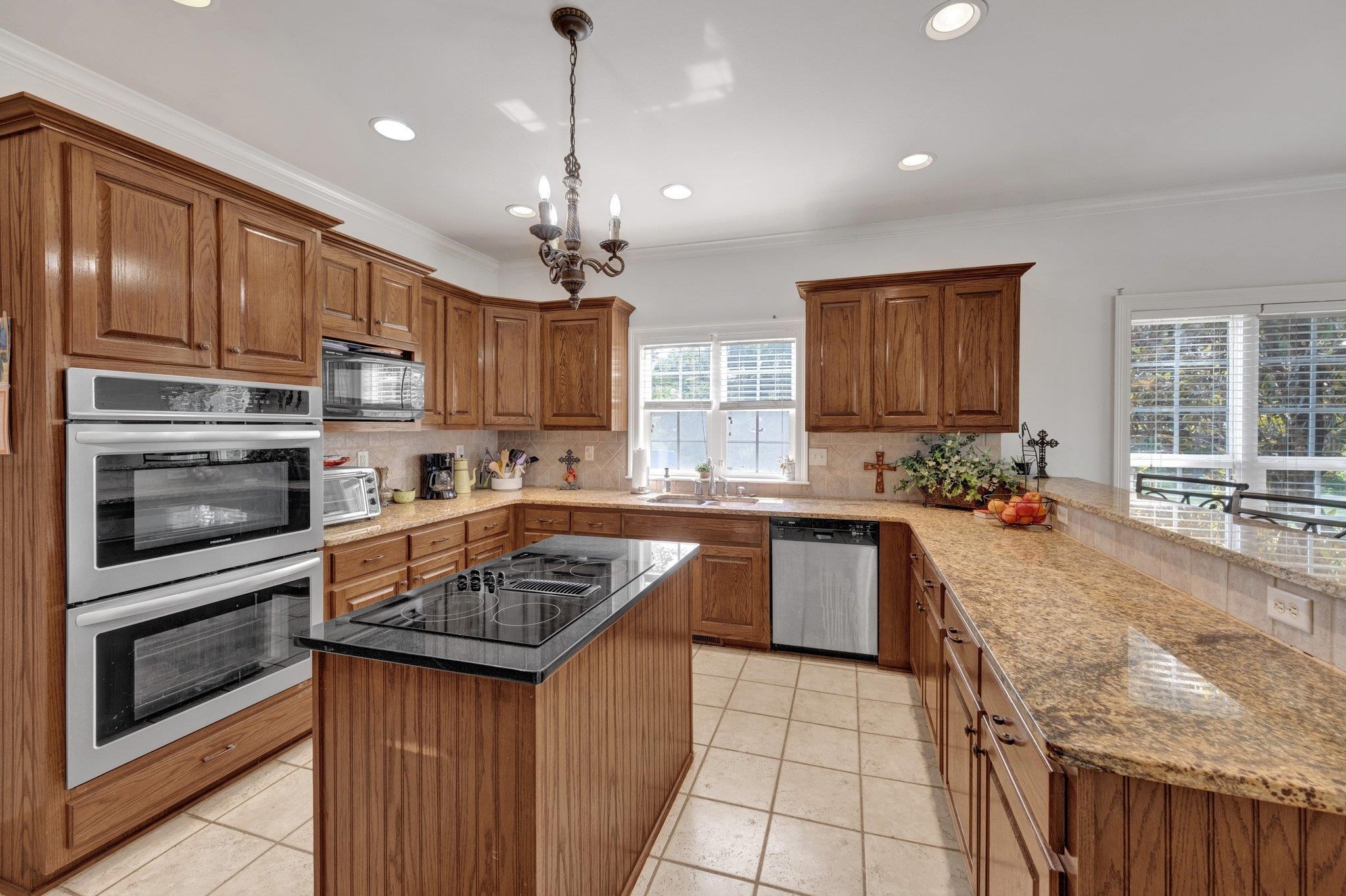 914 Beaver Creek Road Brighton, TN 38011 - Photo 10 of 38 a kitchen with stainless steel appliances granite countertop a sink stove and refrigerator