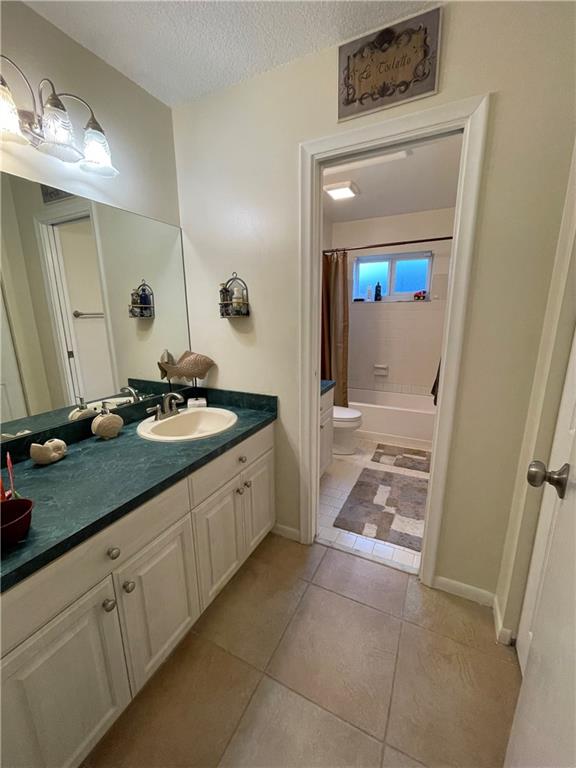8581 Southwest 27th Place Davie, FL 33328 - Photo 7 of 10 a spacious bathroom with a double vanity sink and a mirror