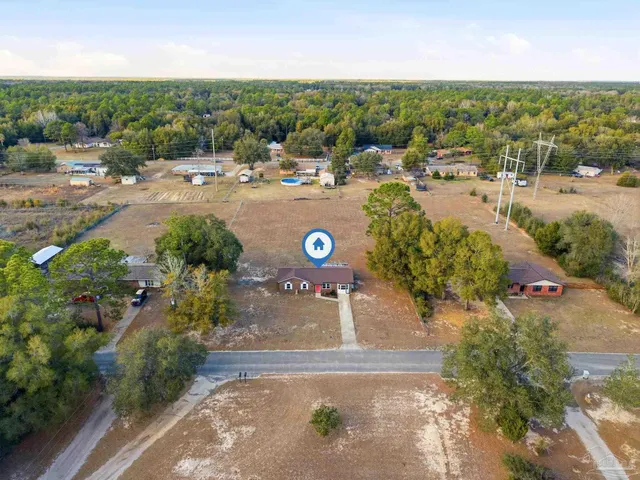 an aerial view of a yard with horses