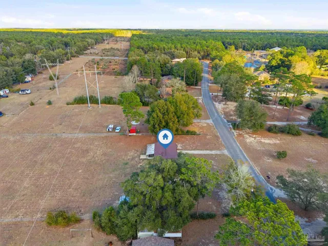 a view of a street with a park