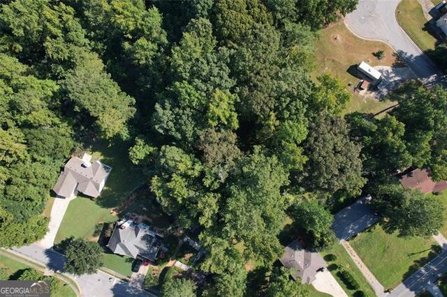 9142 Ford Street Southwest Covington, GA 30014 - Photo 1 of 12 an aerial view of a house with lots of plants