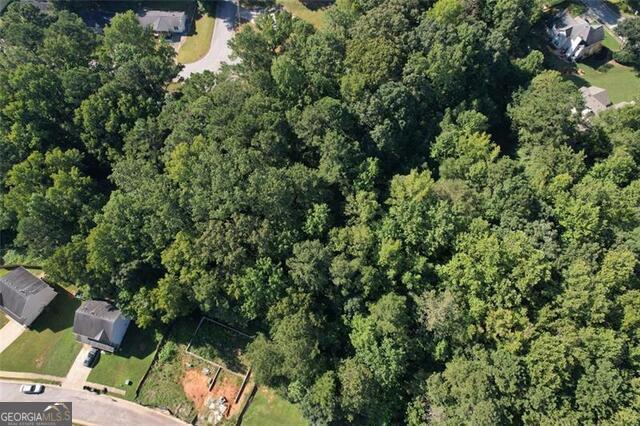 9142 Ford Street Southwest Covington, GA 30014 - Photo 2 of 12 an aerial view of residential house with outdoor space and trees all around