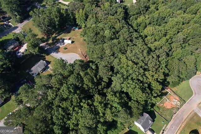 9142 Ford Street Southwest Covington, GA 30014 - Photo 4 of 12 an aerial view of residential house with outdoor space and trees all around