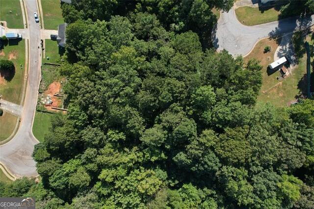 9142 Ford Street Southwest Covington, GA 30014 - Photo 5 of 12 an aerial view of a house with a yard and outdoor seating