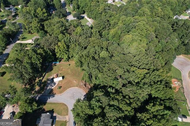 9142 Ford Street Southwest Covington, GA 30014 - Photo 6 of 12 an aerial view of a house with a yard and outdoor seating