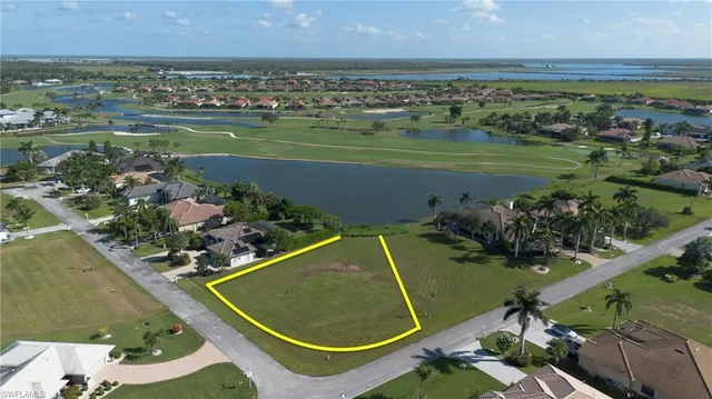 an aerial view of a house with a lake view