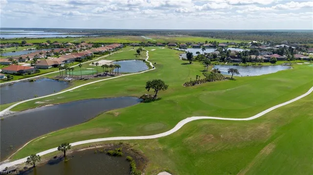 a view of a swimming pool and a yard