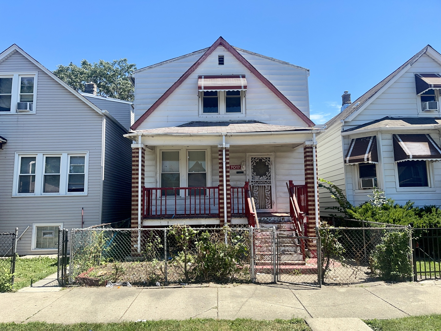 7017 South Wood Street Chicago, IL 60636 - Photo 1 of 25 front view of a house with a yard