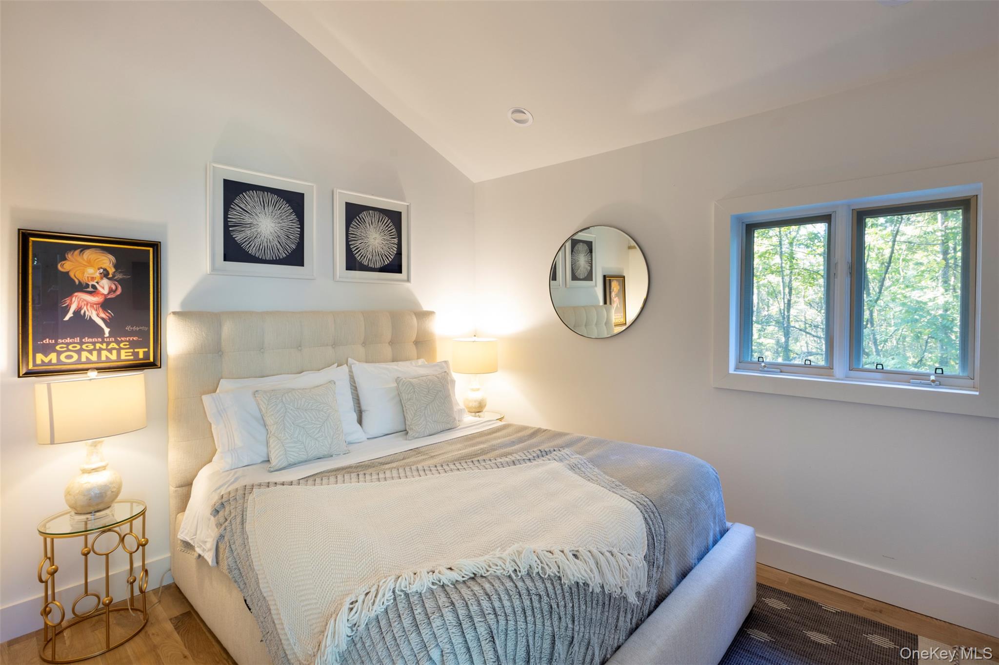 83 Sages Loop Road Kerhonkson, NY 12446 - Photo 17 of 33 a bedroom with a bed and a window