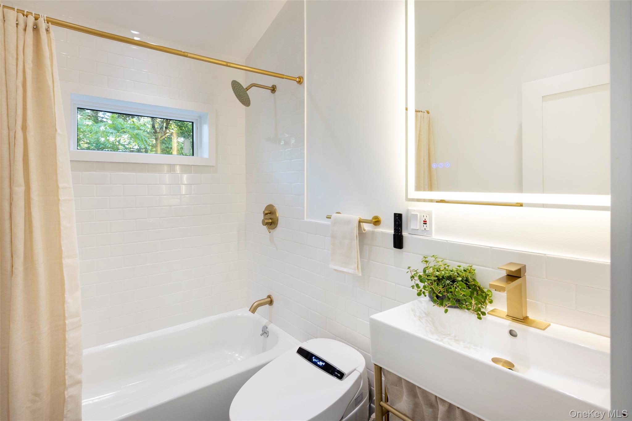 83 Sages Loop Road Kerhonkson, NY 12446 - Photo 18 of 33 a bath room with a sink a toilet and a bath tub