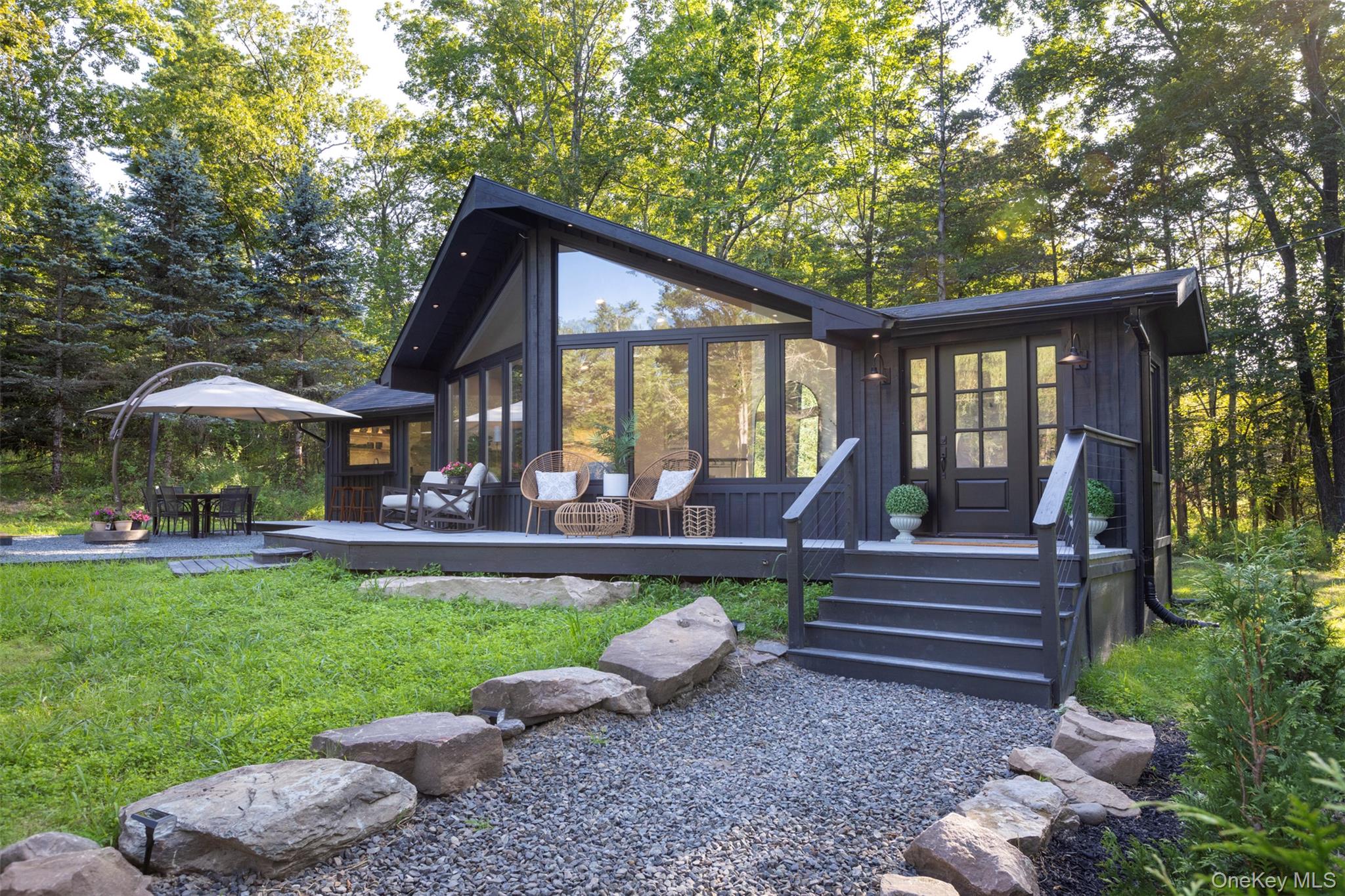 83 Sages Loop Road Kerhonkson, NY 12446 - Photo 2 of 33 a front view of a house with garden