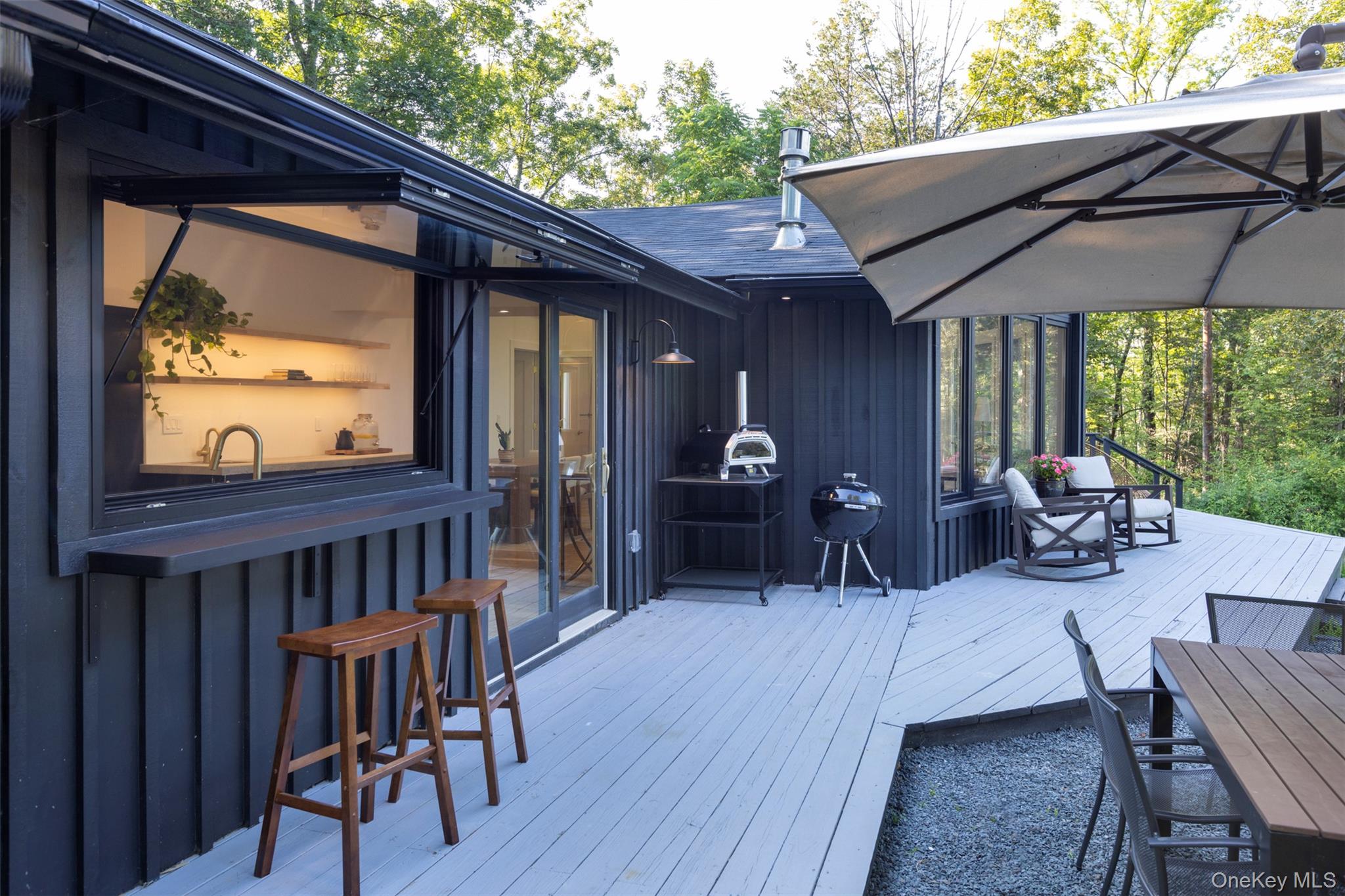 83 Sages Loop Road Kerhonkson, NY 12446 - Photo 3 of 33 a view of a patio with table and chairs with wooden floor and fence