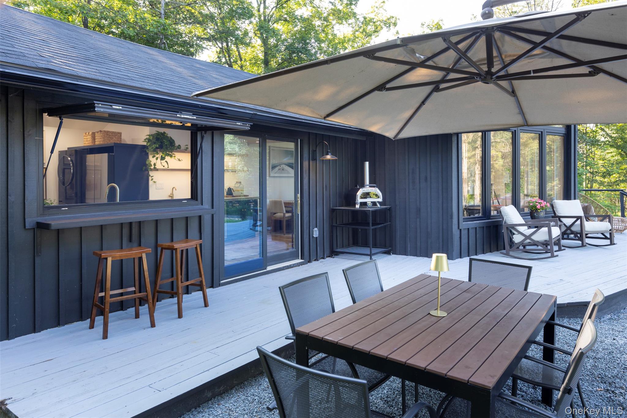 83 Sages Loop Road Kerhonkson, NY 12446 - Photo 5 of 33 a outdoor space with furniture and umbrella