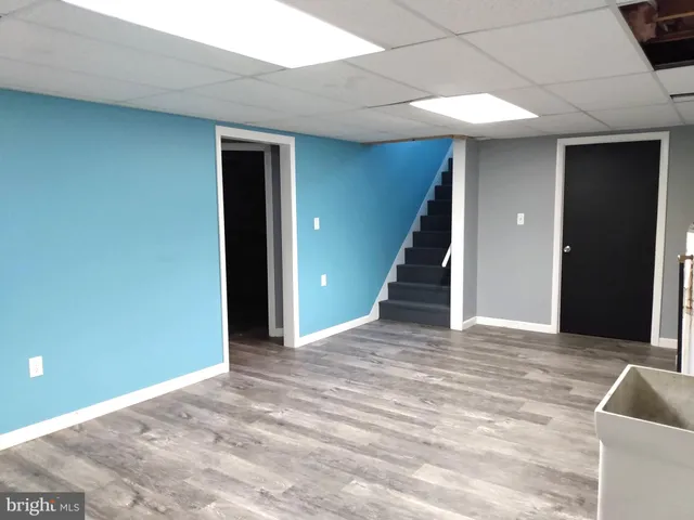 a view of an empty room with stairs