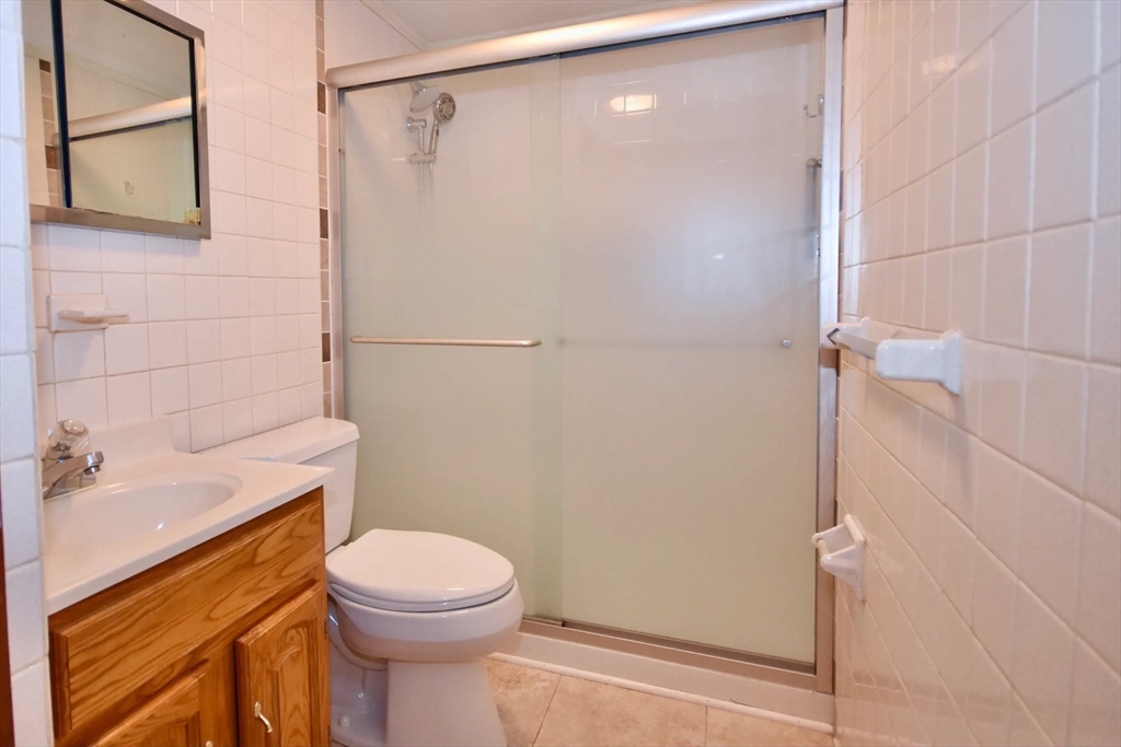 58 Main Avenue Wareham, MA 02558 - Photo 13 of 39 a bathroom with a sink a toilet and shower
