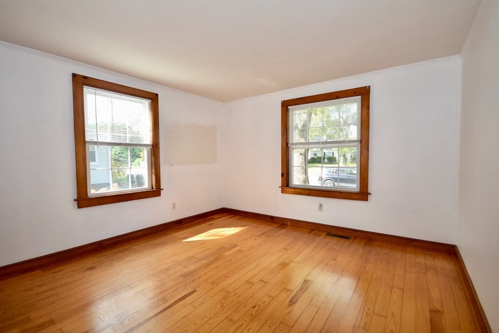 58 Main Avenue Wareham, MA 02558 - Photo 14 of 39 a view of an empty room with wooden floor and a window