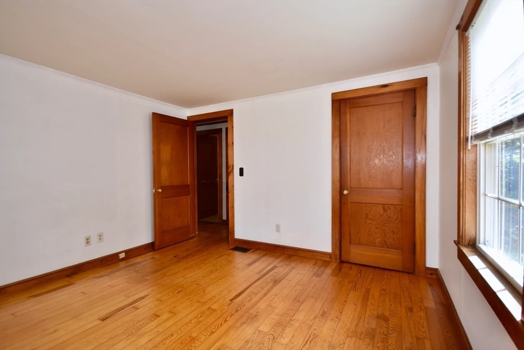58 Main Avenue Wareham, MA 02558 - Photo 16 of 39 a view of an empty room with wooden floor and a window