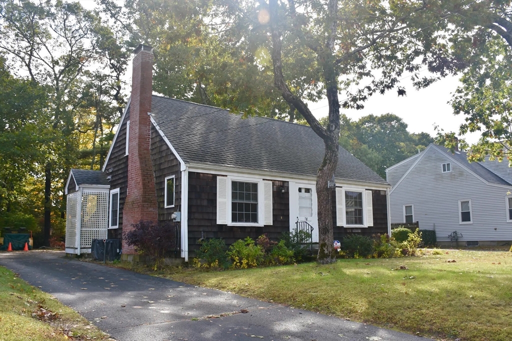 58 Main Avenue Wareham, MA 02558 - Photo 2 of 39 a view of a yard in front of a house with large tree