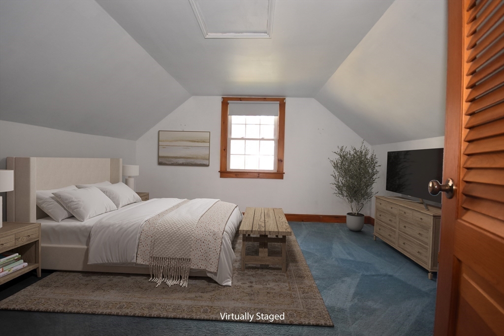 58 Main Avenue Wareham, MA 02558 - Photo 24 of 39 a bedroom with a bed and flat screen tv