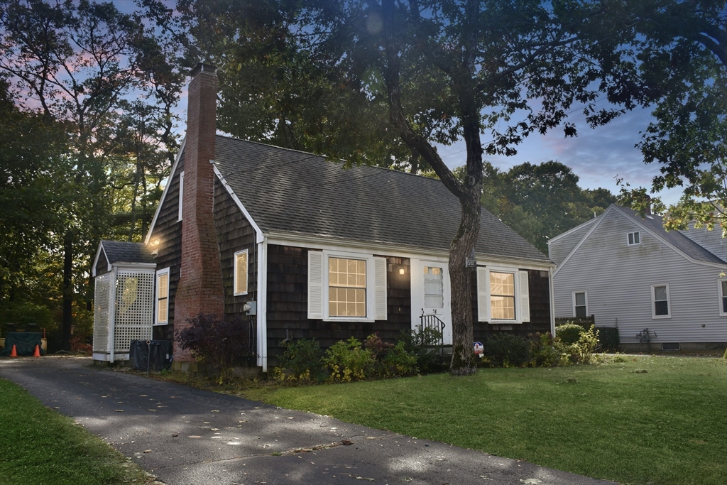 58 Main Avenue Wareham, MA 02558 - Photo 3 of 39 a front view of a house with a garden