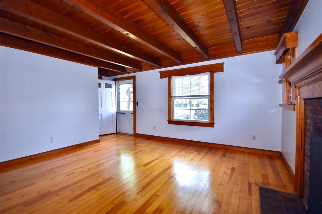 58 Main Avenue Wareham, MA 02558 - Photo 7 of 39 a view of an empty room with wooden floor and fan