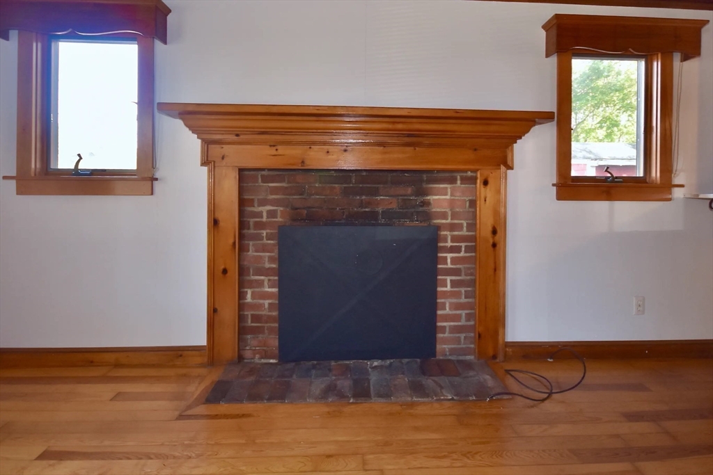 58 Main Avenue Wareham, MA 02558 - Photo 10 of 39 a living room with a fireplace