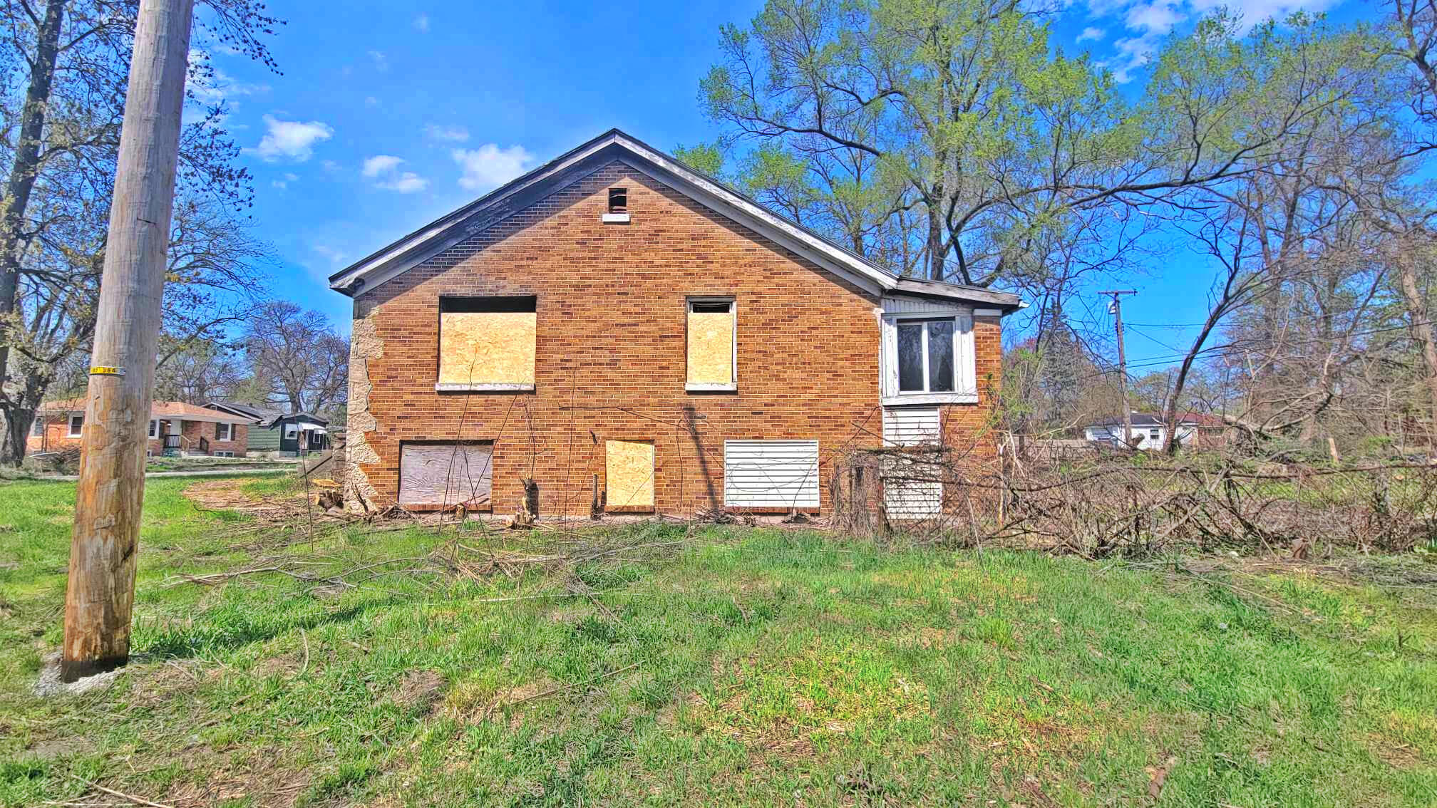4195 Madison Street Gary, IN 46408 - Photo 2 of 6 a front view of a house with garden