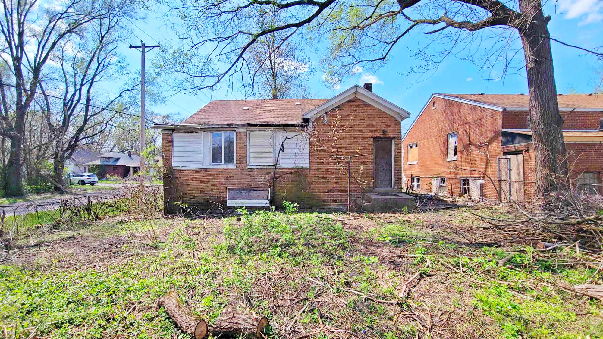 4195 Madison Street Gary, IN 46408 - Photo 4 of 6 a view of a house with a yard