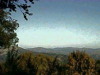 a view of a mountain in the distance in a room