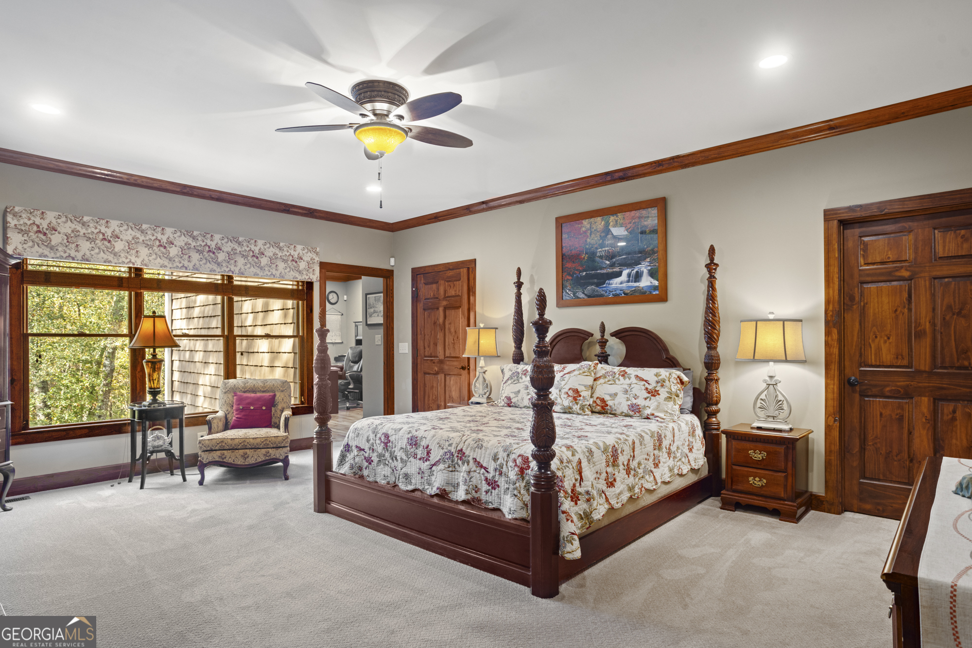 2690 East Lawson Merritt Road Fort Valley, GA 31030 - Photo 7 of 23 a bedroom with a bed and a chandelier