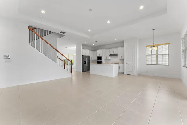 a view of an empty room and a window