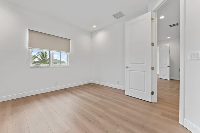 a view of a dining room with furniture wooden floor and chandelier