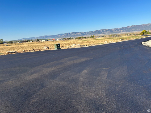 8280 East 15730th St Spring North, Unit 6 Spring City, UT 84662 - Photo 3 of 4 View of asphalt road with a mountain view and a rural view