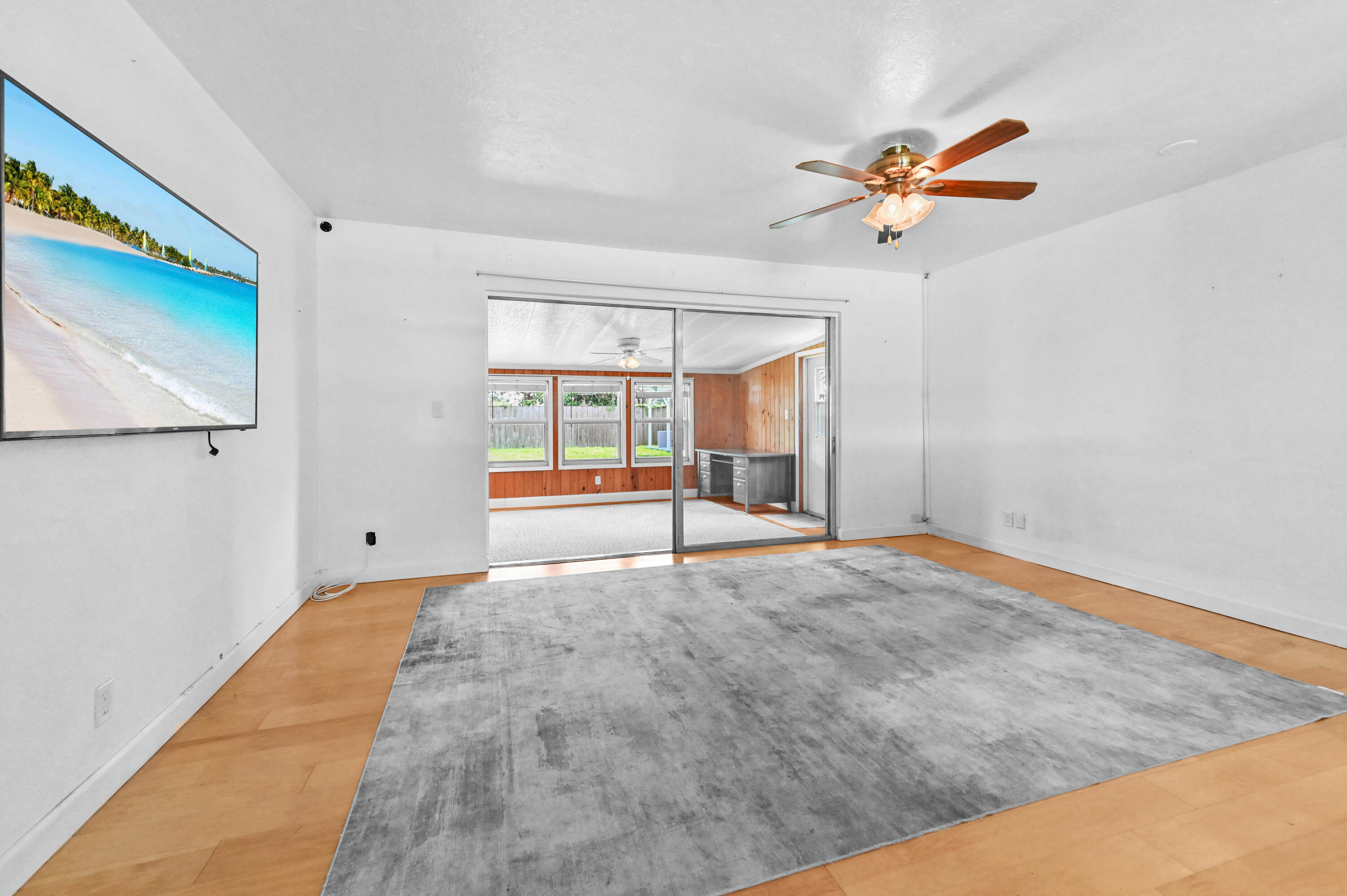 5709 Southeast Indigo Avenue Stuart, FL 34997 - Photo 9 of 26 a view of empty room with ceiling fan