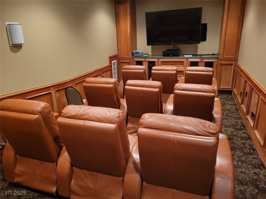 8175 Arville Street, Unit 210 Las Vegas, NV 89139 - Photo 35 of 36 Cinema featuring wainscoting, carpet floors, and a decorative wall