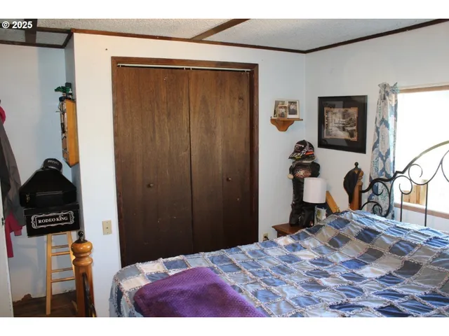 a bedroom with a bed and a view of bathroom
