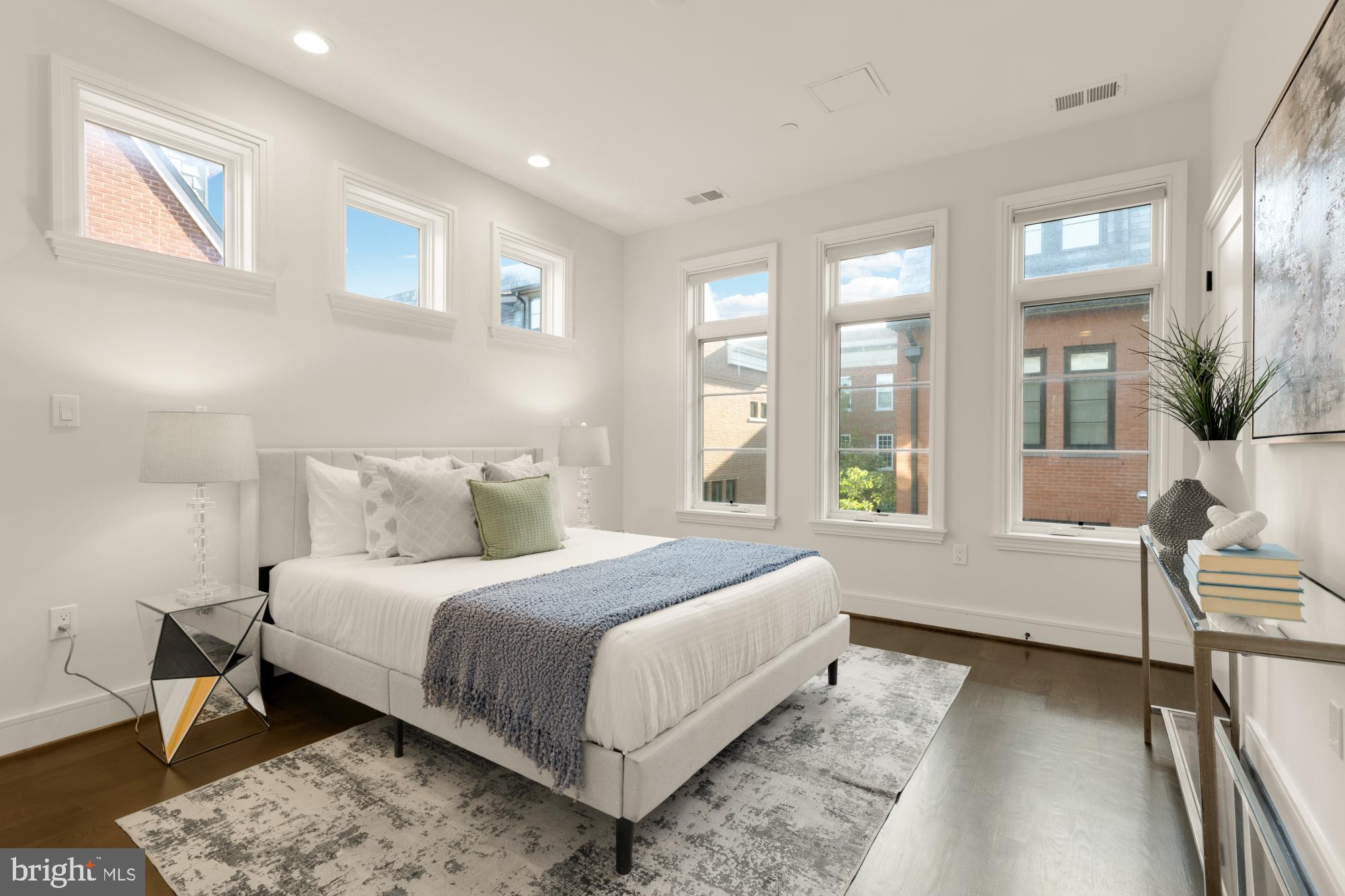 412 13th Street Southeast Washington, DC 20003 - Photo 20 of 62 a bedroom with a large bed and a large window