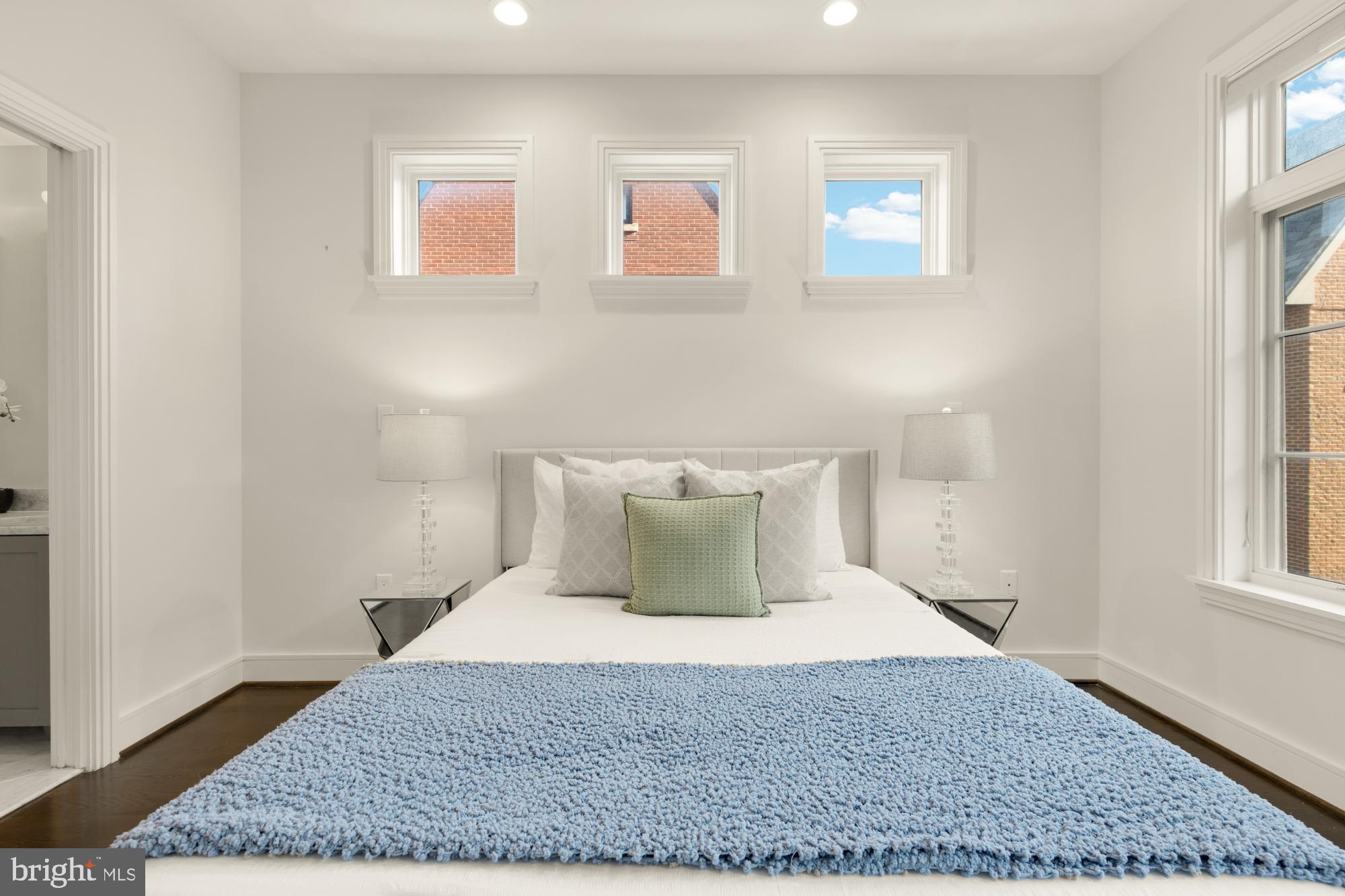 412 13th Street Southeast Washington, DC 20003 - Photo 21 of 62 a bedroom with a bed and wooden floor