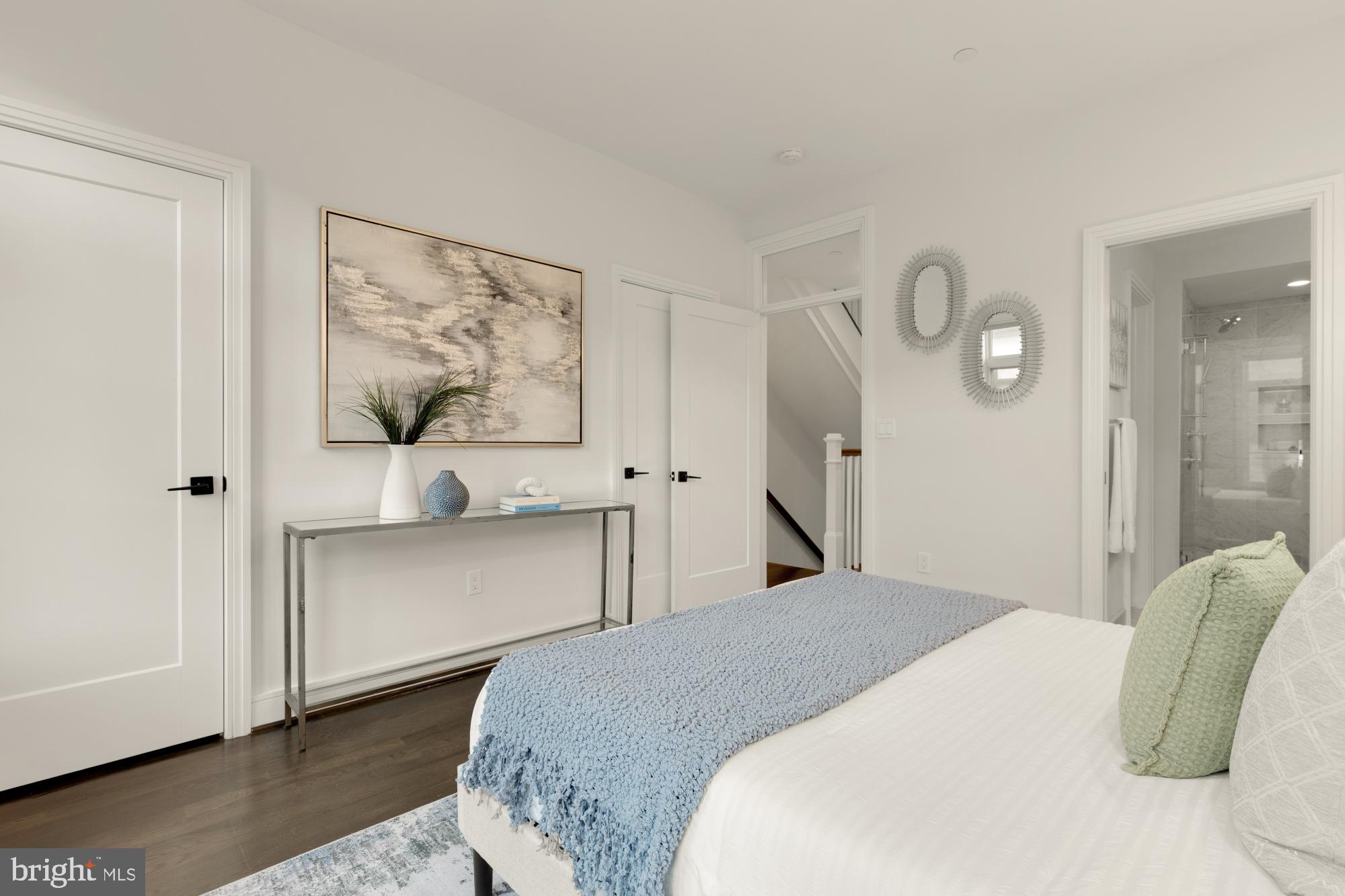 412 13th Street Southeast Washington, DC 20003 - Photo 22 of 62 a bedroom with a bed and a painting on the wall