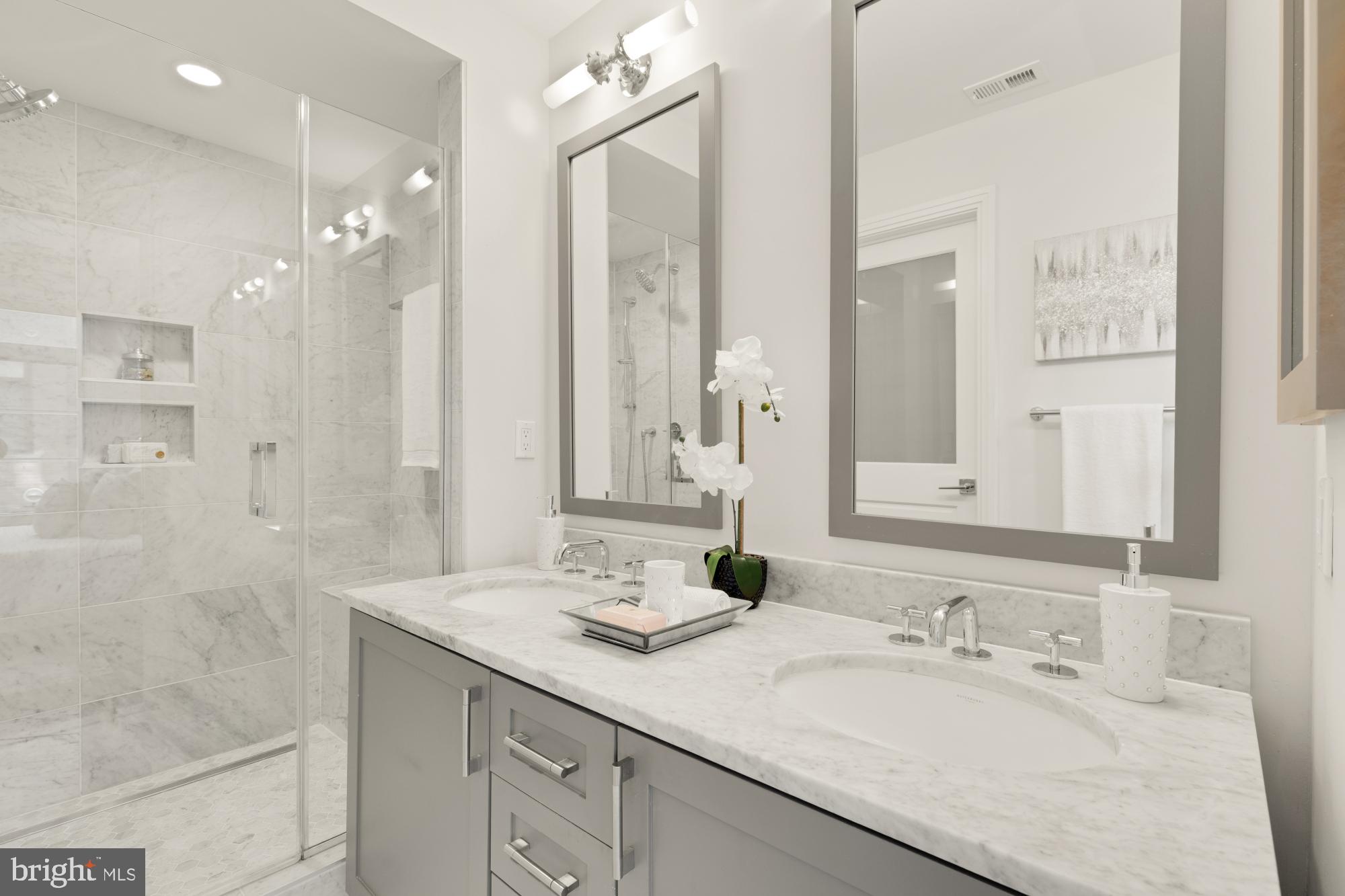 412 13th Street Southeast Washington, DC 20003 - Photo 23 of 62 a bathroom with a granite countertop sink mirror and a shower