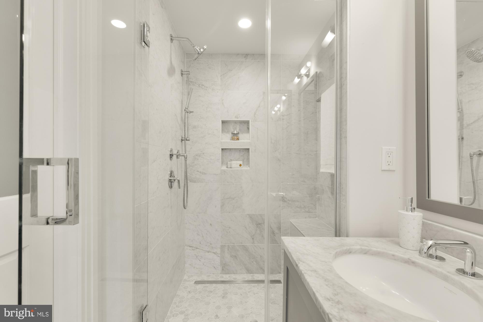 412 13th Street Southeast Washington, DC 20003 - Photo 24 of 62 a bathroom with a sink shower and a mirror