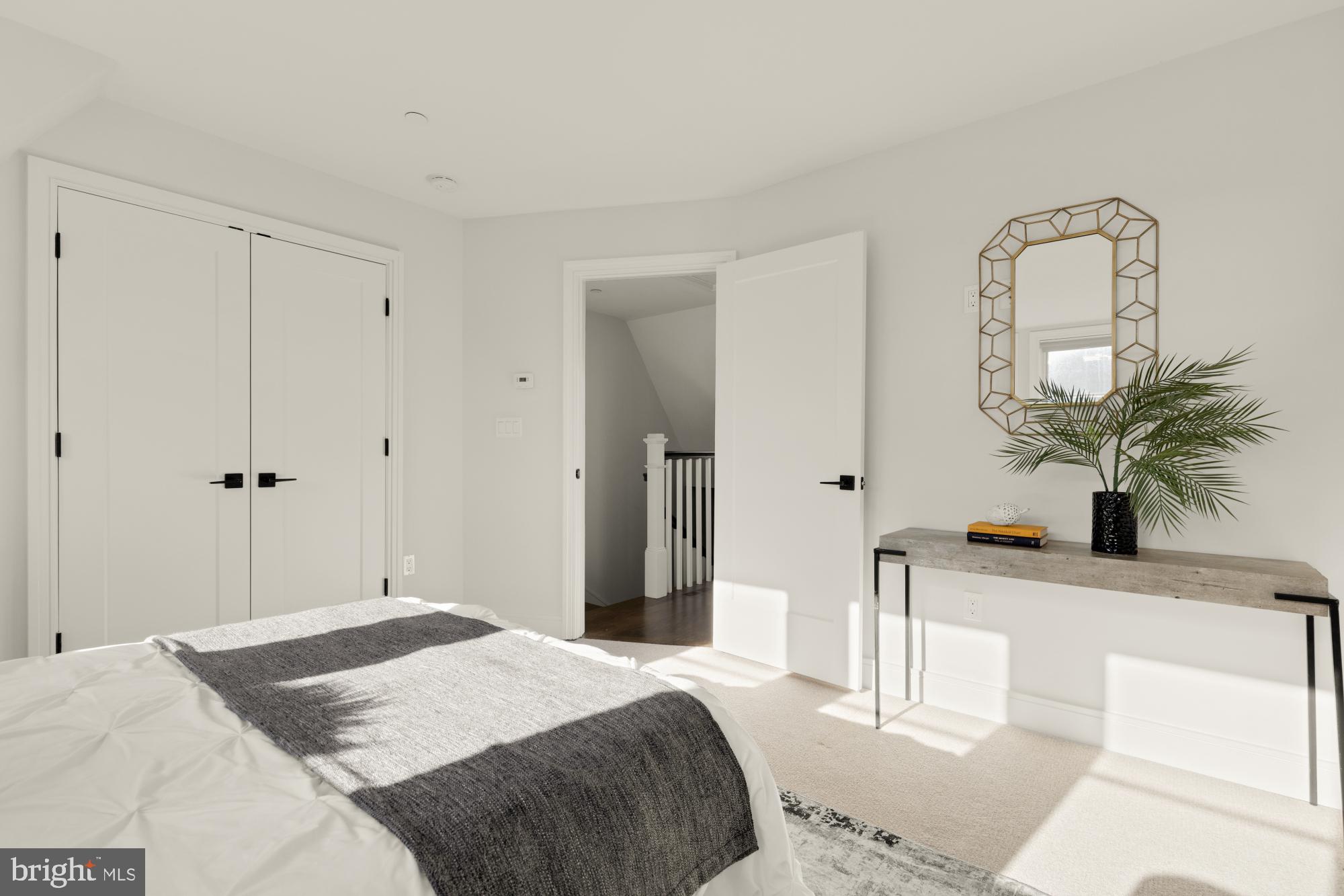 412 13th Street Southeast Washington, DC 20003 - Photo 35 of 62 a bedroom with a bed and a potted plant