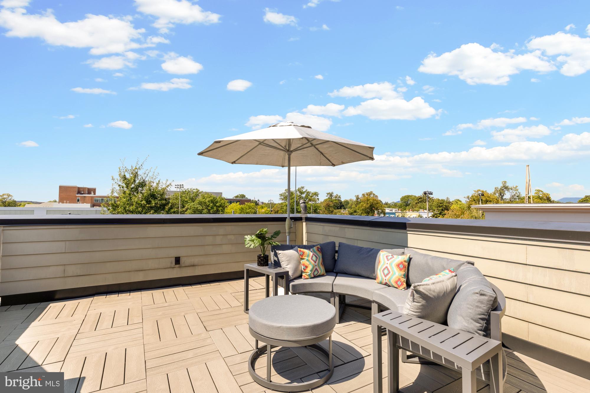 412 13th Street Southeast Washington, DC 20003 - Photo 37 of 62 a view of a lake with couches chairs and umbrella