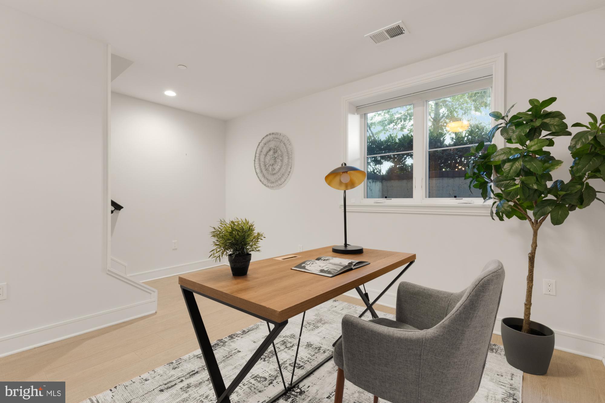 412 13th Street Southeast Washington, DC 20003 - Photo 43 of 62 a table room with furniture and a potted plant