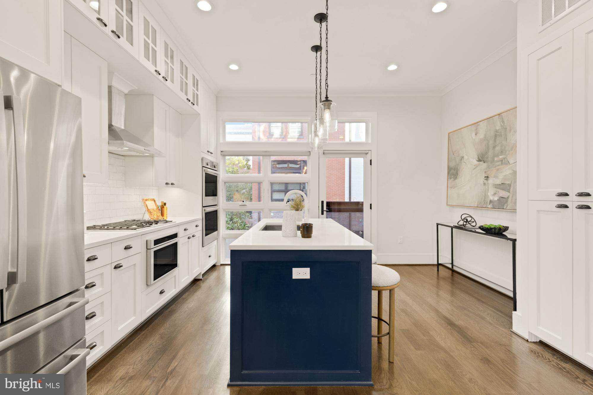 412 13th Street Southeast Washington, DC 20003 - Photo 8 of 62 a kitchen with stainless steel appliances granite countertop a sink stove and refrigerator